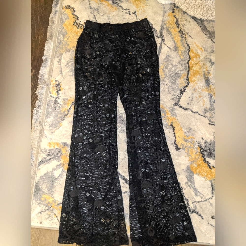 Black skeleton flared mesh pants
